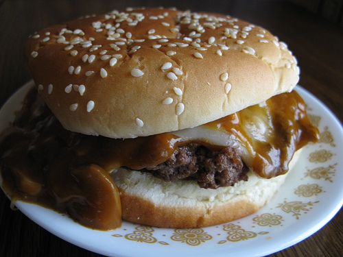 Mushroom burger with melted cheese on a sesame bun