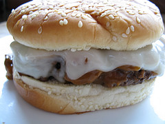 Mushroom burger with melted cheese on a sesame bun