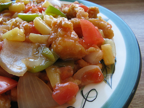 Sweet and sour chicken with bell peppers and pineapple