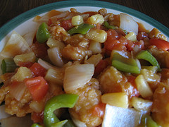 Sweet and sour chicken with bell peppers and pineapple