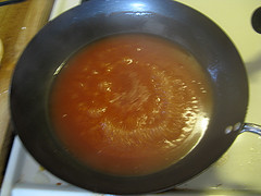 Sweet and sour sauce simmering in a pan