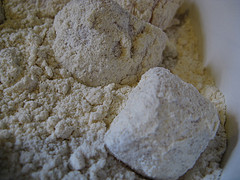 Raw chicken pieces coated in flour