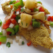 Cajun tilapia topped with pineapple and diced vegetables