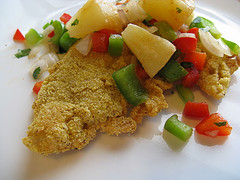 Cajun tilapia topped with pineapple and diced vegetables