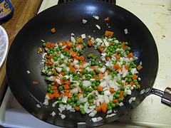 Close up of Chinese fried rice with peas carrots and egg