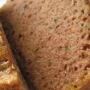 Close up view of prepared, sliced zucchini bread.