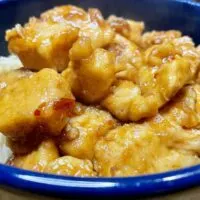 Prepared bourbon chicken in bowl.