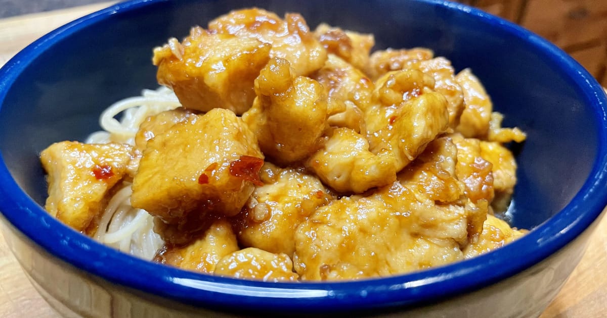 Prepared bourbon chicken in bowl.