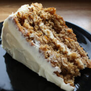 Slice of prepare carrot cake on plate.