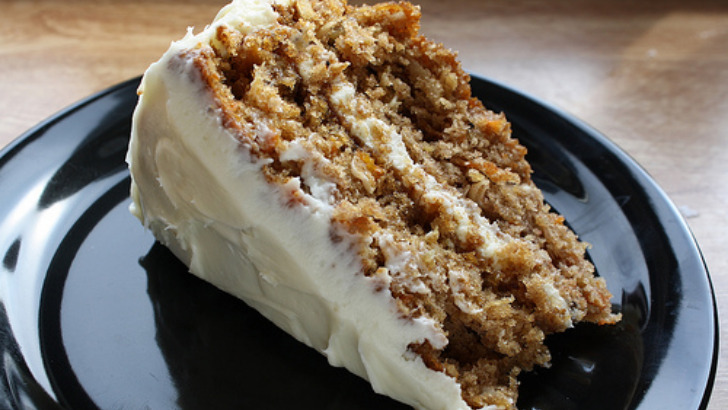 Slice of prepare carrot cake on plate.