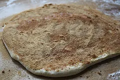 Bread machine cinnamon roll dough rolled out.