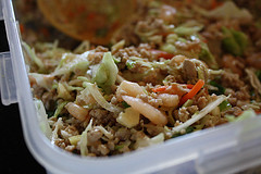 Bowl of vegetable filling mixture with shredded carrots and cabbage