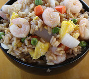 owl of shrimp fried rice with peas, carrots, onions, and scrambled eggs