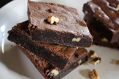 Chocolate brownies stacked on a plate