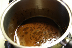 Saucepan with melted chocolate mixture being stirred
