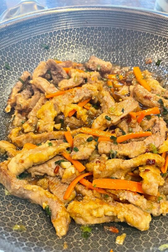 Stir-frying ginger beef.