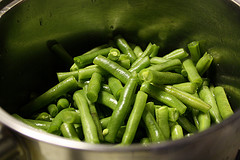 Fresh green beans in a stainless steel bowl