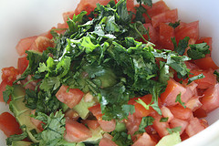 Chopped tomato and herbs for guacamole bruschetta