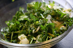 Fresh chopped cilantro and onion in a glass bowl