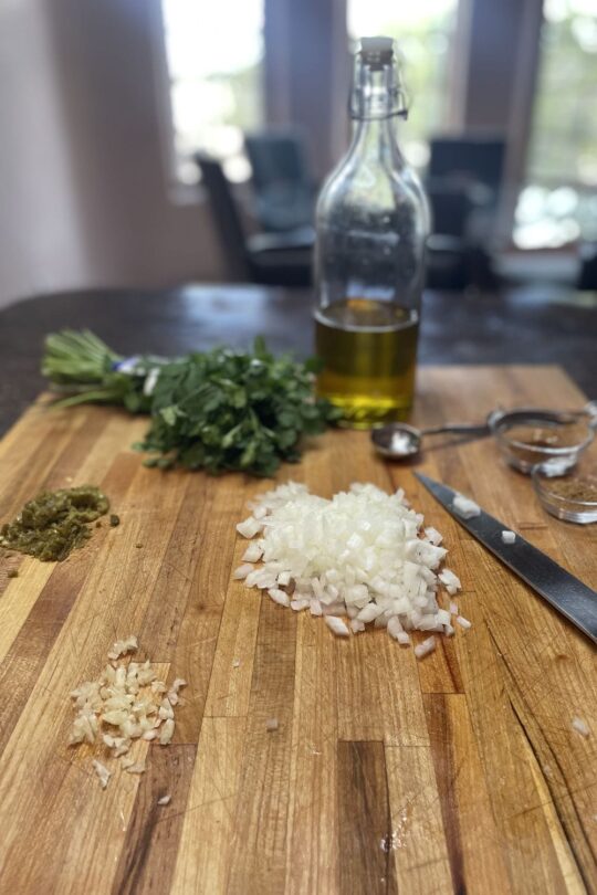 Ingredients for turkey tacos on cutting board. 