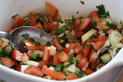 Bowl of freshly chopped tomatoes, onions, cilantro, and green peppers
