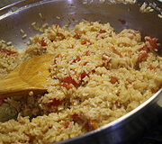 Shrimp and rice mixture simmering in a pan