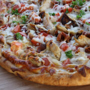Chicken bacon ranch pizza on a wooden surface
