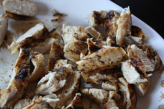 Cooked chicken pieces for chicken bacon ranch pizza