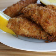 Fried fish fillets served with lemon