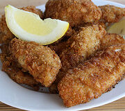 Fried fish fillets served with lemon