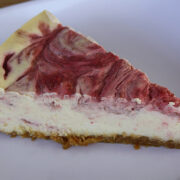 slice of strawberry swirl cheesecake