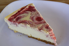slice of strawberry swirl cheesecake
