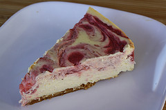 slice of strawberry swirl cheesecake