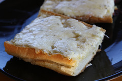 Homemade garlic bread with melted butter and herbs