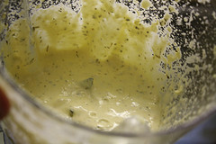 Garlic butter mixture with herbs in a glass bowl for making homemade garlic bread