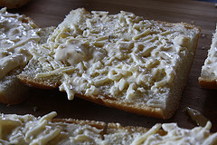 Homemade garlic bread with melted butter and herbs