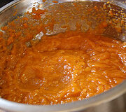 Pumpkin and spice mixture in a metal mixing bowl.