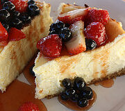 rich classic cheesecake topped with fresh berries