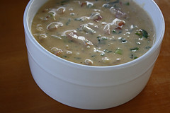 White bowl filled with cheesy chili con queso dip