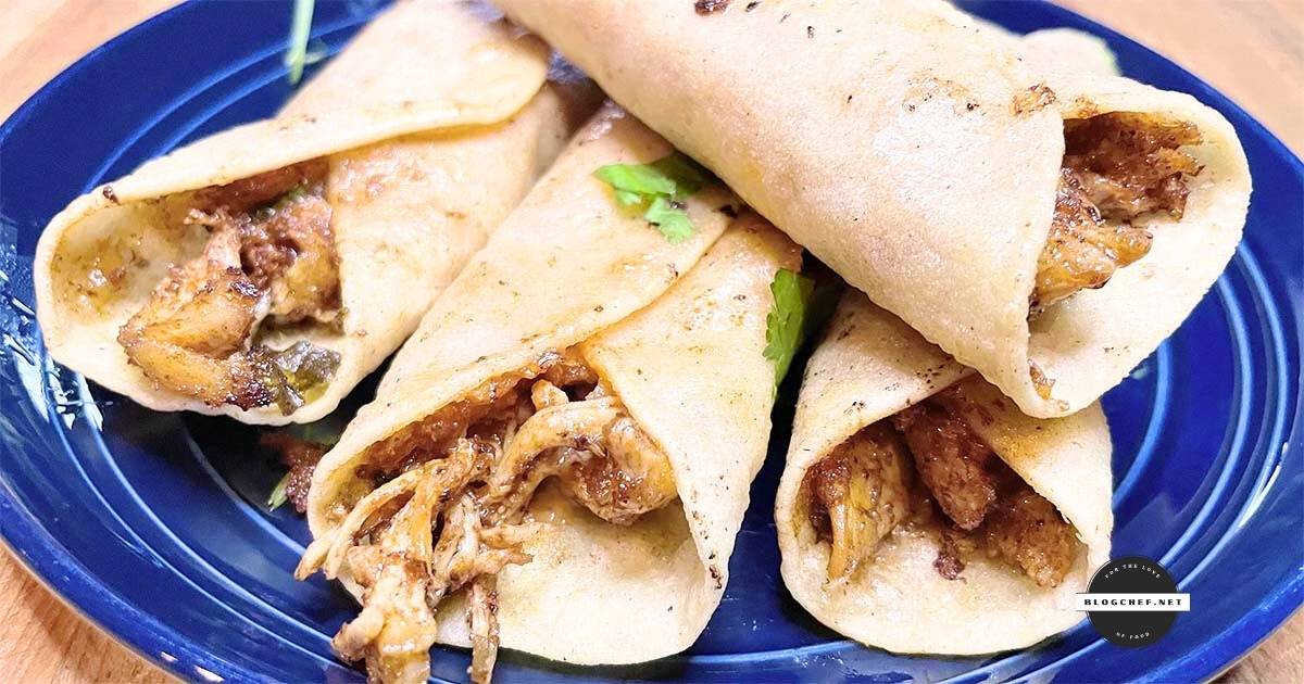 Prepared fried chicken taquitos with cilantro.