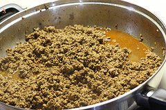 Ground beef cooking in skillet for Mexican casserole