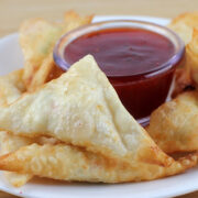 Cream cheese wontons with crab filling served with dipping sauce