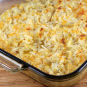 Golden baked hashbrown casserole in a glass dish