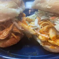 Close up view of buffalo chicken sliders.