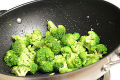 Fresh broccoli florets in a wok