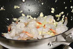 Shrimp and garlic cooking in a wok