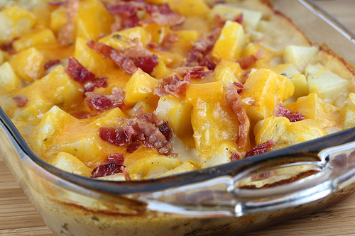 Ranch potatoes baked with cheese and bacon in a glass dish