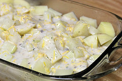 iced potatoes coated in creamy ranch sauce in a baking dish