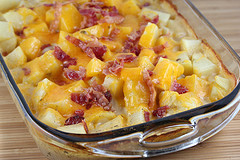 Ranch potatoes baked with cheese and bacon in a glass dish