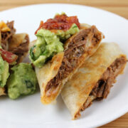 prepared beef chimichanga with guacamole and salsa
